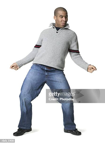 full body shot of a young adult male in a grey sweater as he playfully dances - man full body isolated stock pictures, royalty-free photos & images