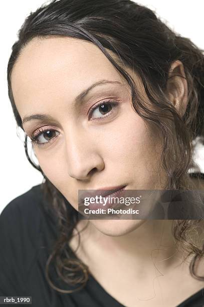 close up shot of a young adult woman in a black shirt as she looks into the camera - finger waves ストックフォトと画像