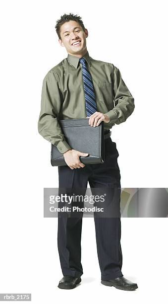full body shot of a young adult business man in a green shirt as he smiles - full body isolated bildbanksfoton och bilder