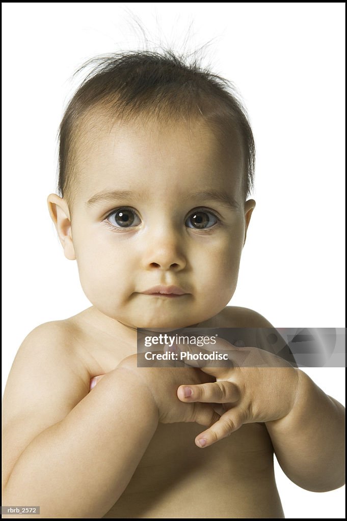 Portrait of a female baby as she looks at the camera