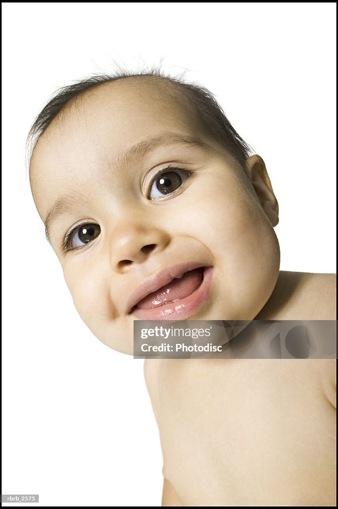 Portrait of a female baby as she smiles brightly at the camera