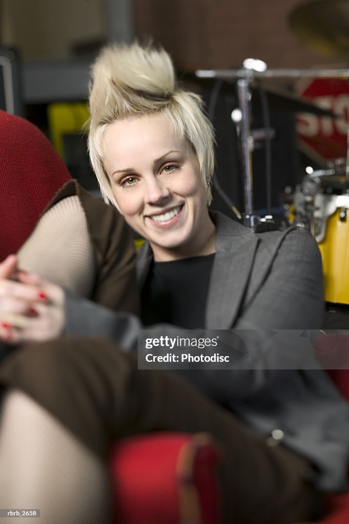 Teenage lifestyle shot of a blonde female as she smiles at the camera