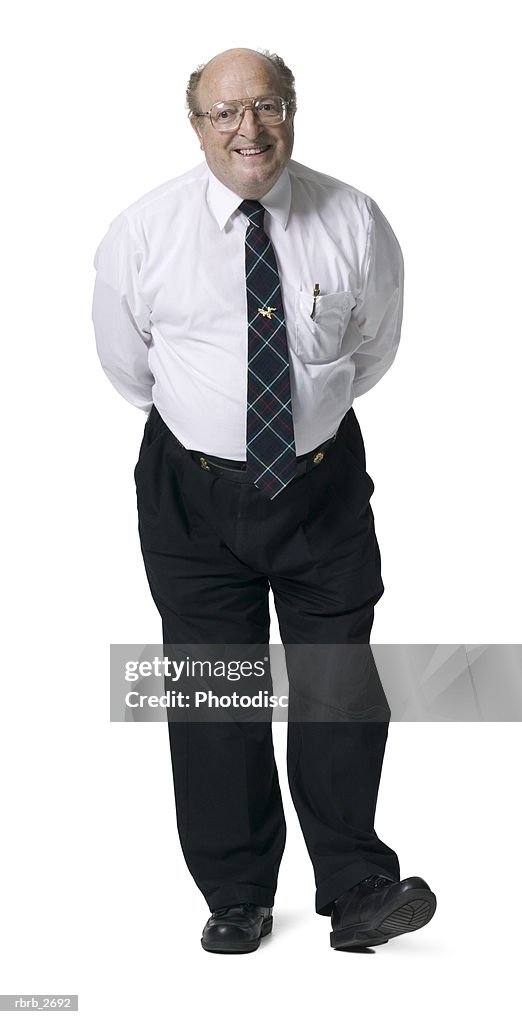 Full length shot of a mature adult male in a shirt and tie as he smiles at the camera