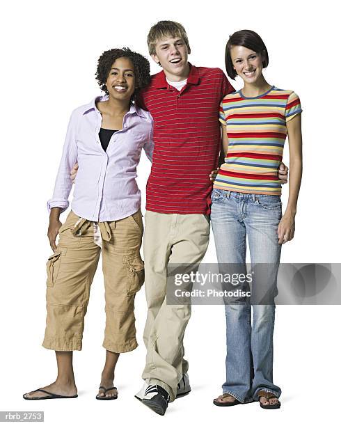 full length shot of a group of three teenage friends as they smile at the camera - smile bildbanksfoton och bilder