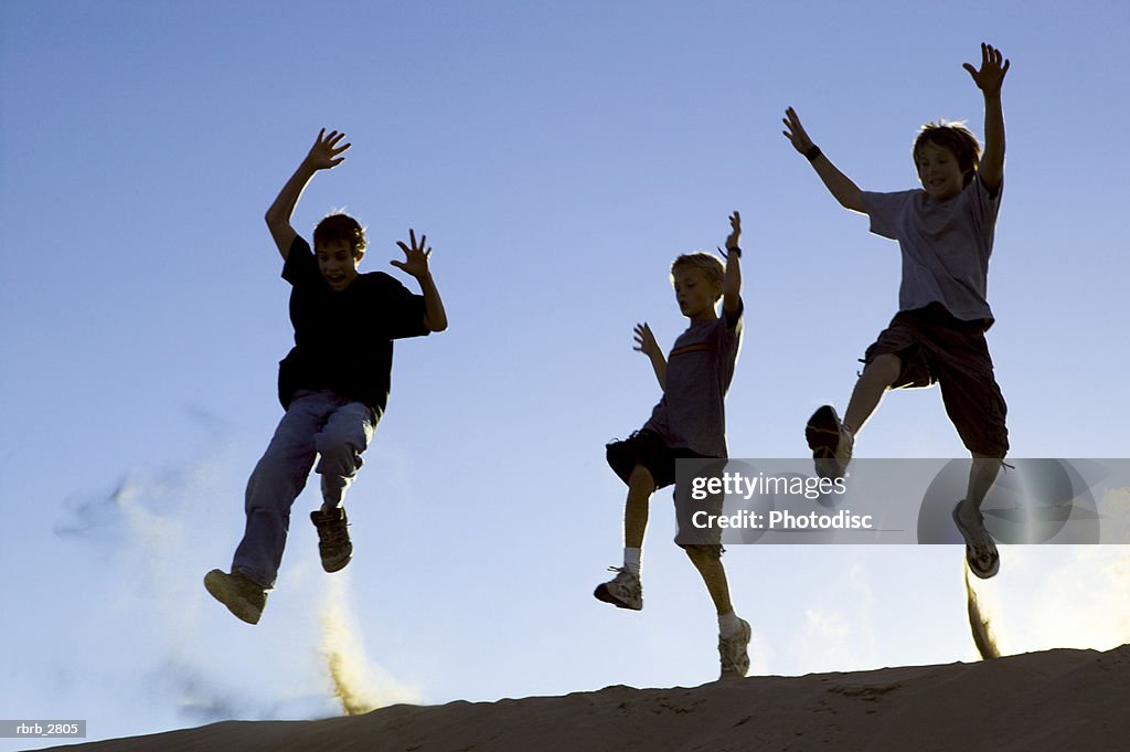 Three boys jumping