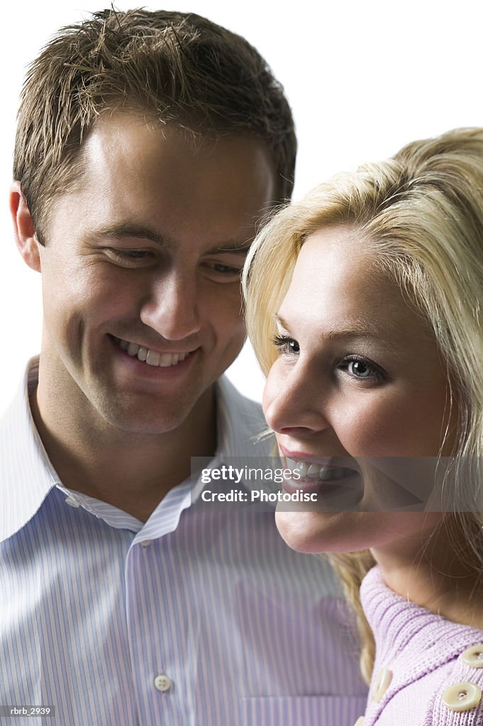 Young couple standing together smiling