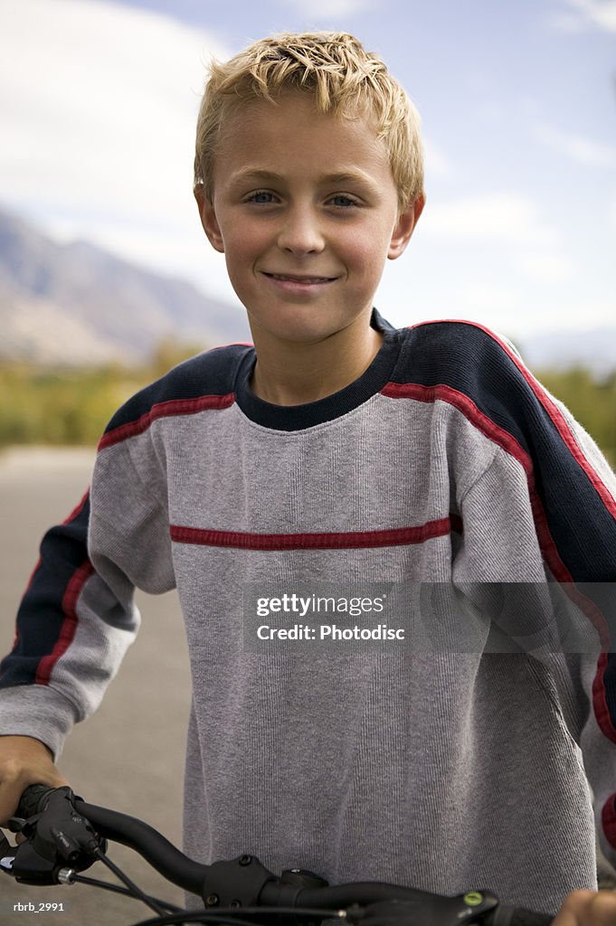 Portrait of a boy with a bicycle