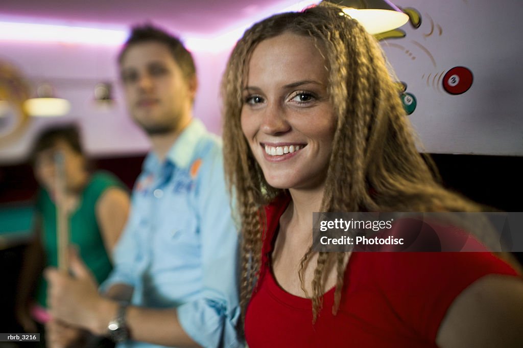 Portrait of a group of young people at a pool hall