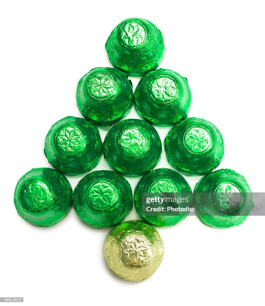Chocolates wrapped in colored foil arranged in the shape of a Christmas tree