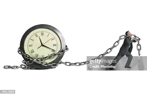 mature man pulling a clock - hour hand stock pictures, royalty-free photos & images