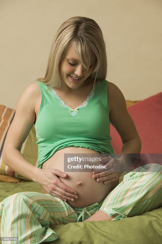 Young pregnant woman smiling
