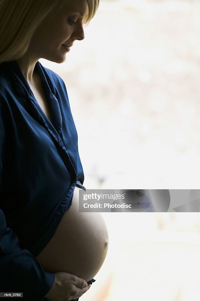 Side profile of a young pregnant woman