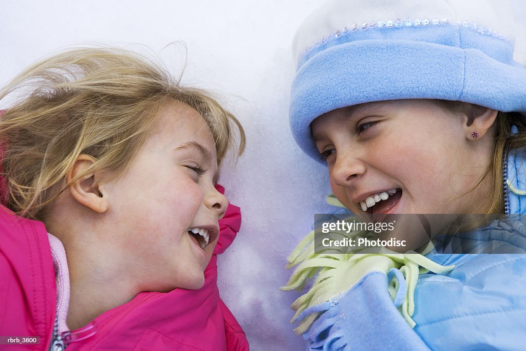 Close-up of two girls (4-5) smiling