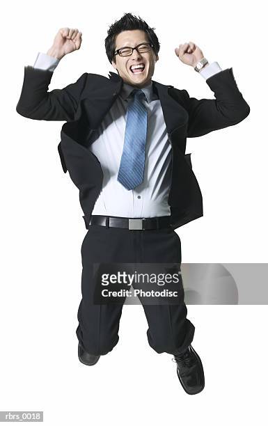 full body shot of a young adult business man as he jumps up in celebration - full body isolated bildbanksfoton och bilder