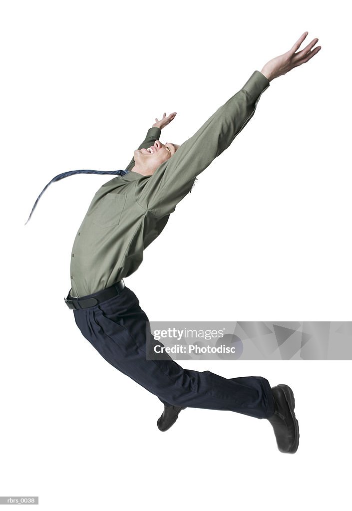 Full body shot of a young adult male in a shirt and tie as he jumps up playfully in the air