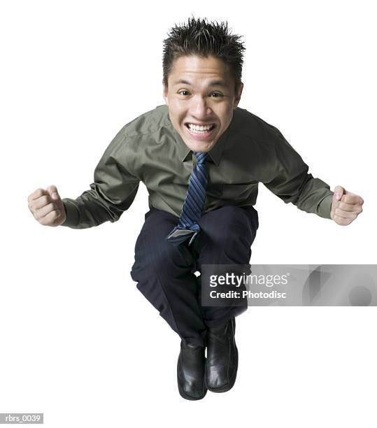 full body shot of a young adult male in a shirt and tie as he jumps up and smiles - man full body isolated stock pictures, royalty-free photos & images