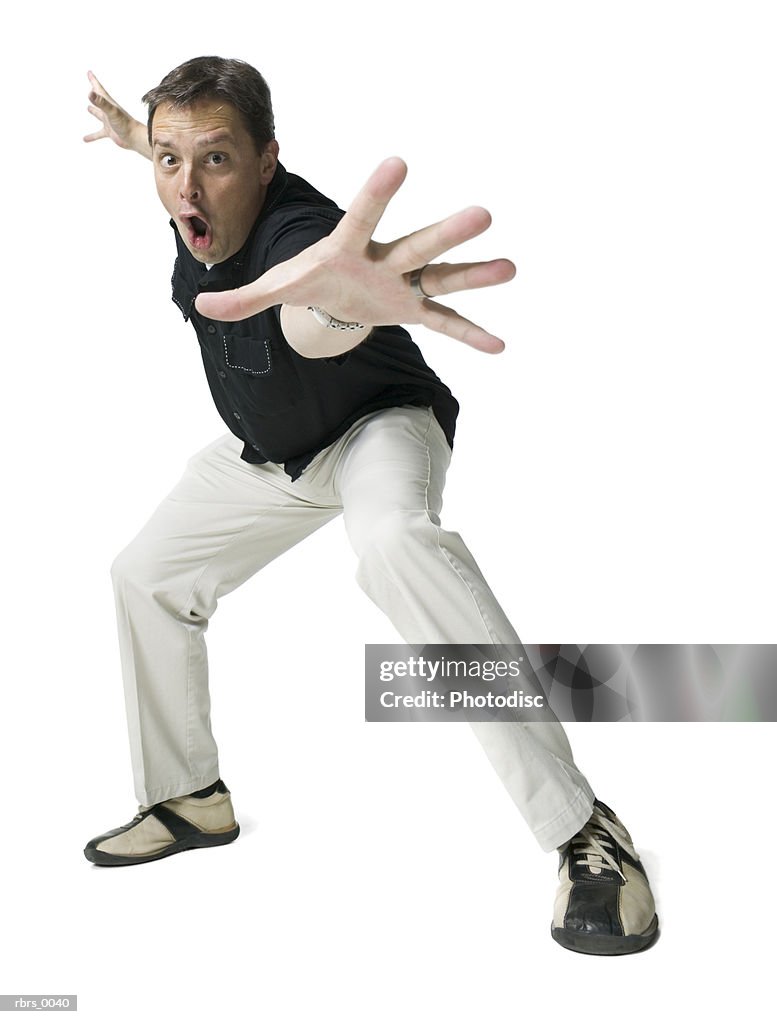 Low Angle Full Body Shot Of An Adult Male In A Black Shirt As He Strikes A Funny  Pose High-Res Stock Photo - Getty Images