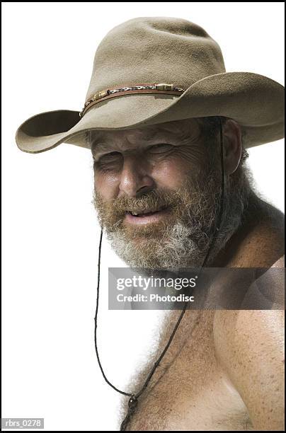 real people portrait of an adult man with no shirt and a hat as he turns and looks at the camera - no photos et images de collection