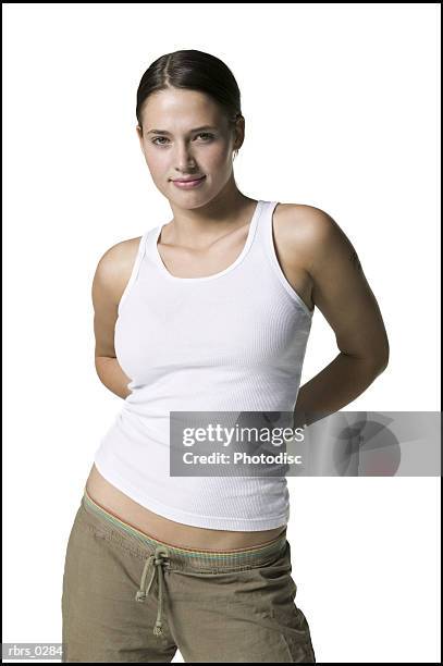 beauty portrait of a young adult woman in a white tank top as she poses for the camera - black border stock pictures, royalty-free photos & images