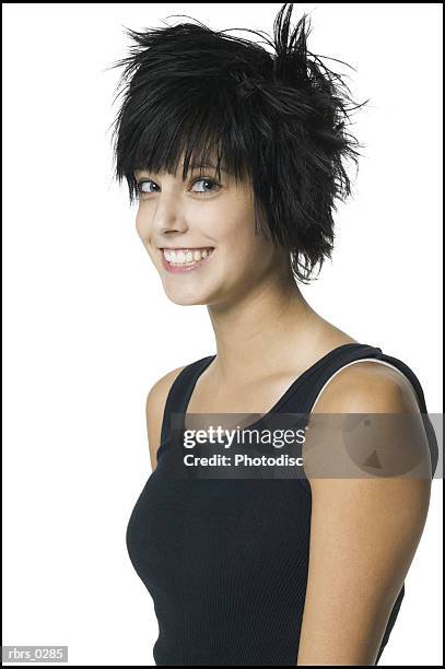 portrait of a teenage girl in a black tank top as she turns and smiles into the camera - black border stock pictures, royalty-free photos & images