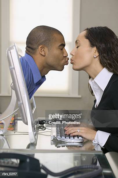 conceptual shot of a young adult woman who kisses a man coming out of her computer - people coming of age purify with icy water in tokyo stockfoto's en -beelden