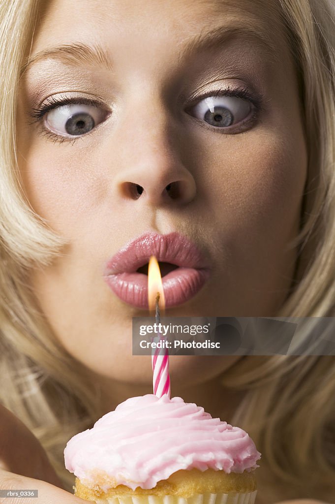 Young woman with a birthday candle