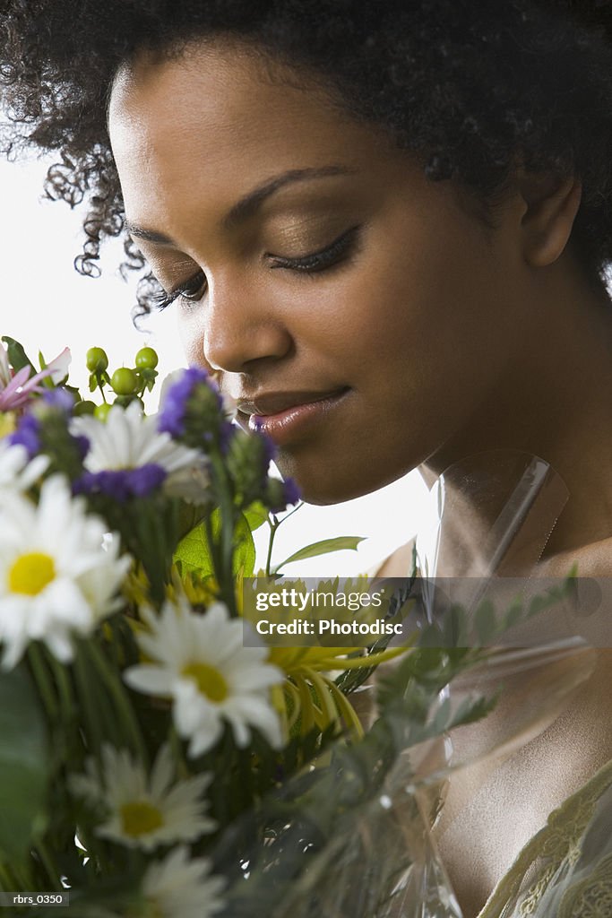 Young woman smelling flowers