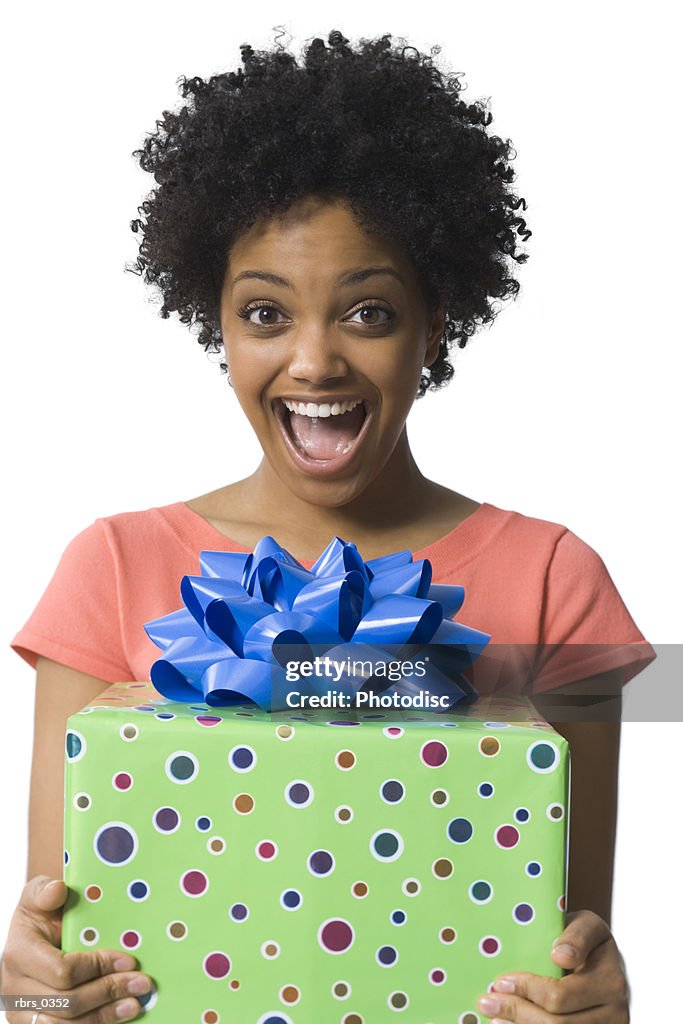 Portrait of a young woman holding a gift