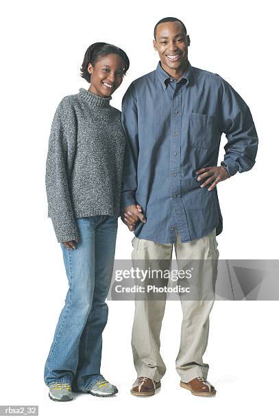 a young african american couple stands together and smile - smile bildbanksfoton och bilder