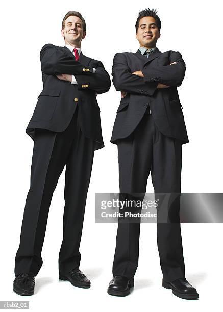 low angle of two business men in suits as they fold their arms and smile - smile imagens e fotografias de stock