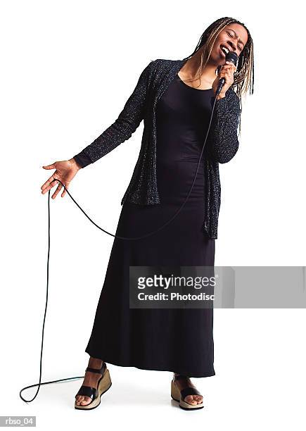an african american nightclub singer holds a microphone and belts out a song - kristin kreuk or sierra mccormick or autumn wendel or brenda song or allison munn or emil imagens e fotografias de stock