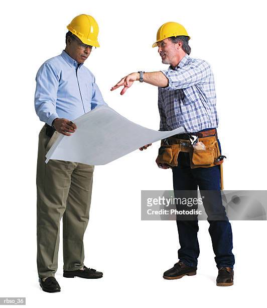 an african american contractor discusses the plans with a caucasian foreman - foreman stock pictures, royalty-free photos & images
