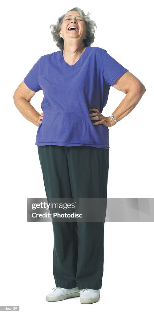 Mature woman laughing with hands on her hip