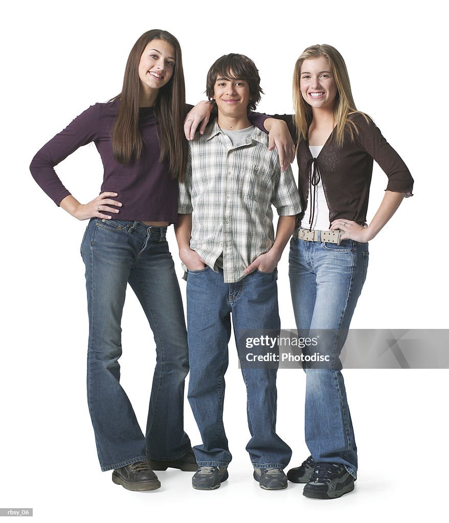 Portrait of an ethnic teenage boy as he stands between two of his teenage female friends