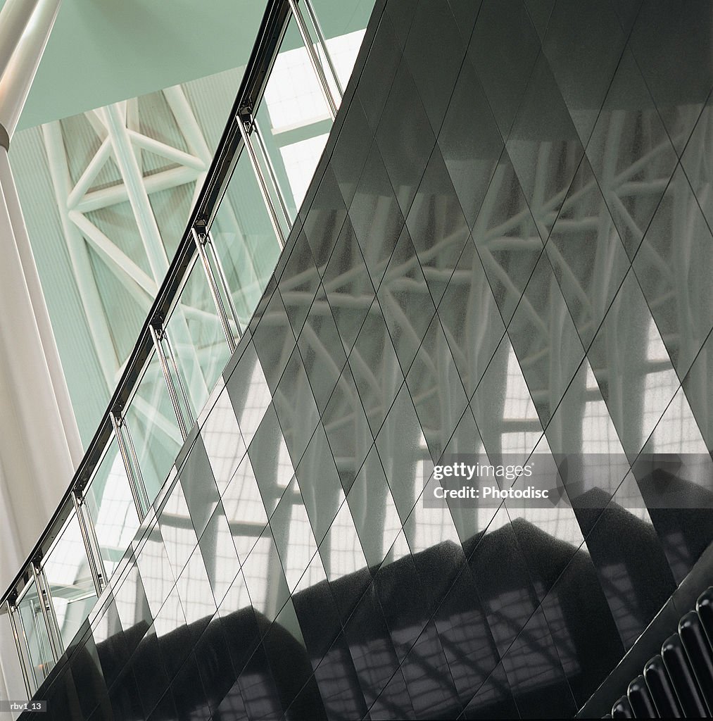 A ceiling reflects in a wall of mirrors giving the allusion of infinity