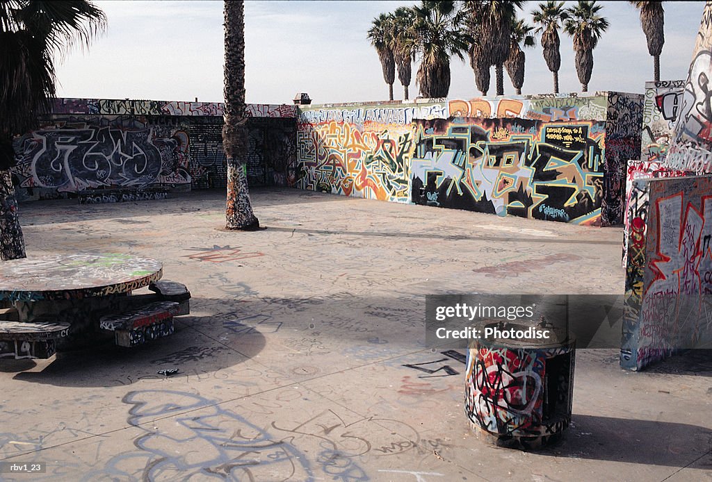 A playground_s stone table and benches have been covered with graffiti