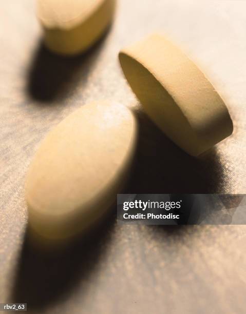 medicine pills lie on a light surface and cast shadows - cast of amcs low winter sun q a with art house convergence stockfoto's en -beelden