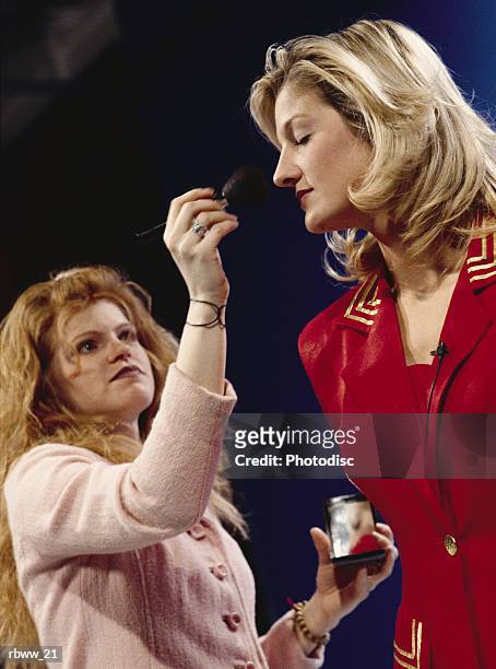 a caucasian make-up artist works on a model - the weinstein company hosts special screening of the artist stockfoto's en -beelden