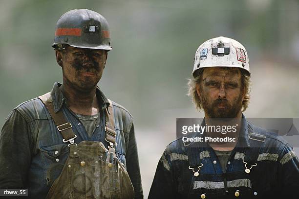 portrait of two soiled hard-working caucasian coal miners - coal miner stock pictures, royalty-free photos & images