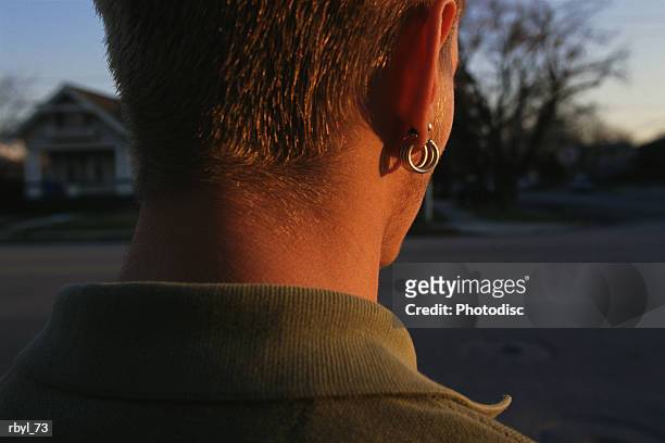 the back of a young mans neck - body modification stock-fotos und bilder