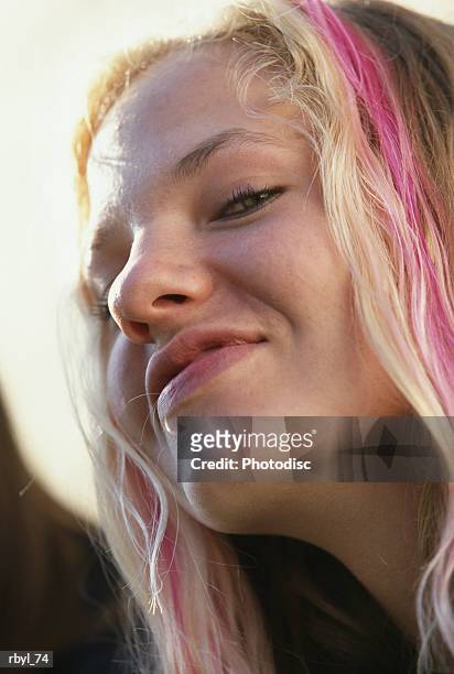 the headshot of a young teenage girl with blond and pink hair who is smiling confidntly at the camera - is stock pictures, royalty-free photos & images