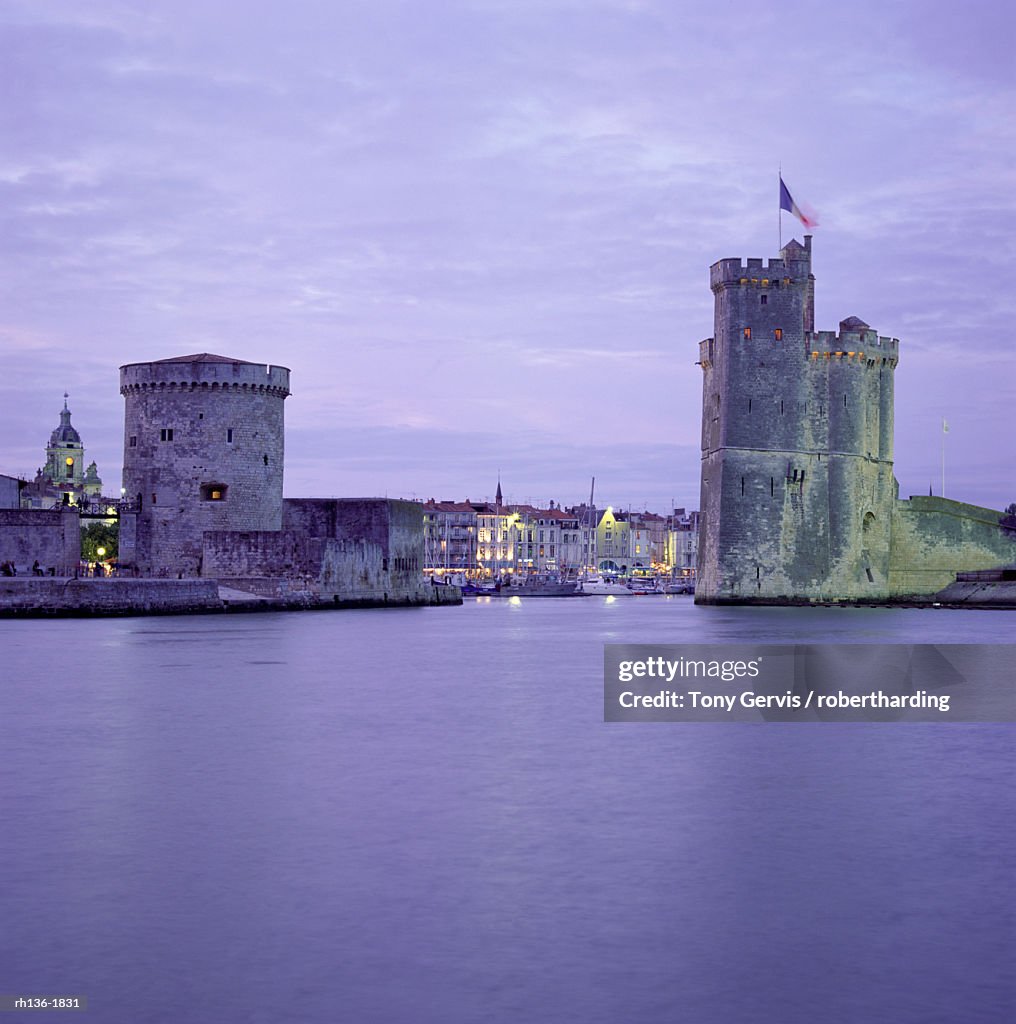 Harbour entrance with Tour de la Chaine on left and Tour St. Nicolas (St. Nicholas Tower) on right, La Rochelle, Poitou Charentes, France, Europe