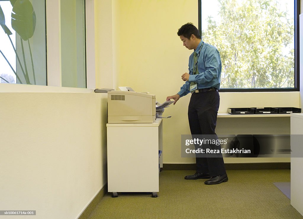 Business Man Using Fax Machine In Office High-Res Stock Photo - Getty ...