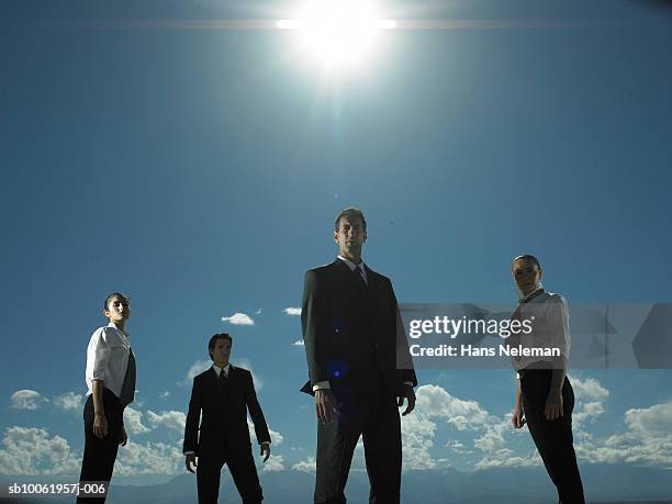 group of businesspeople standing, low angle view - 低角度觀看 個照片及圖片檔