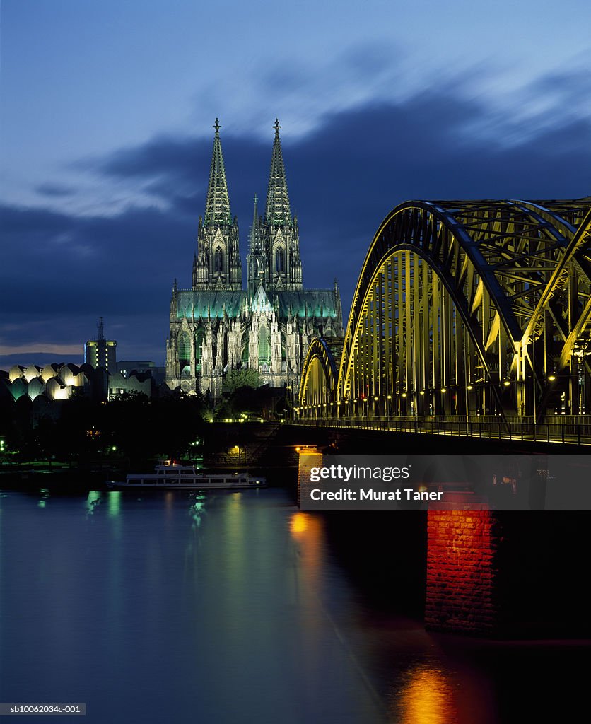 Germany, Cologne skyline with Cathedral and Hohenzollern Bridge on the banks over the Rhine River.