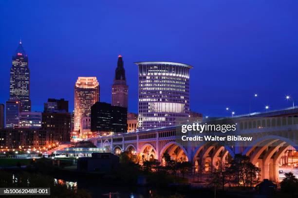 usa, ohio, cleveland, downtown view with detroit avenue bridge from flats area - cleveland ohio flats stock pictures, royalty-free photos & images