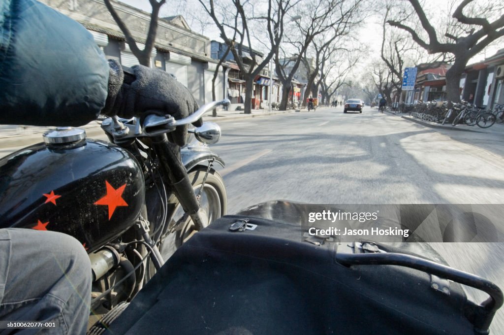 Motorcycle with sidecar on street, personal perspective