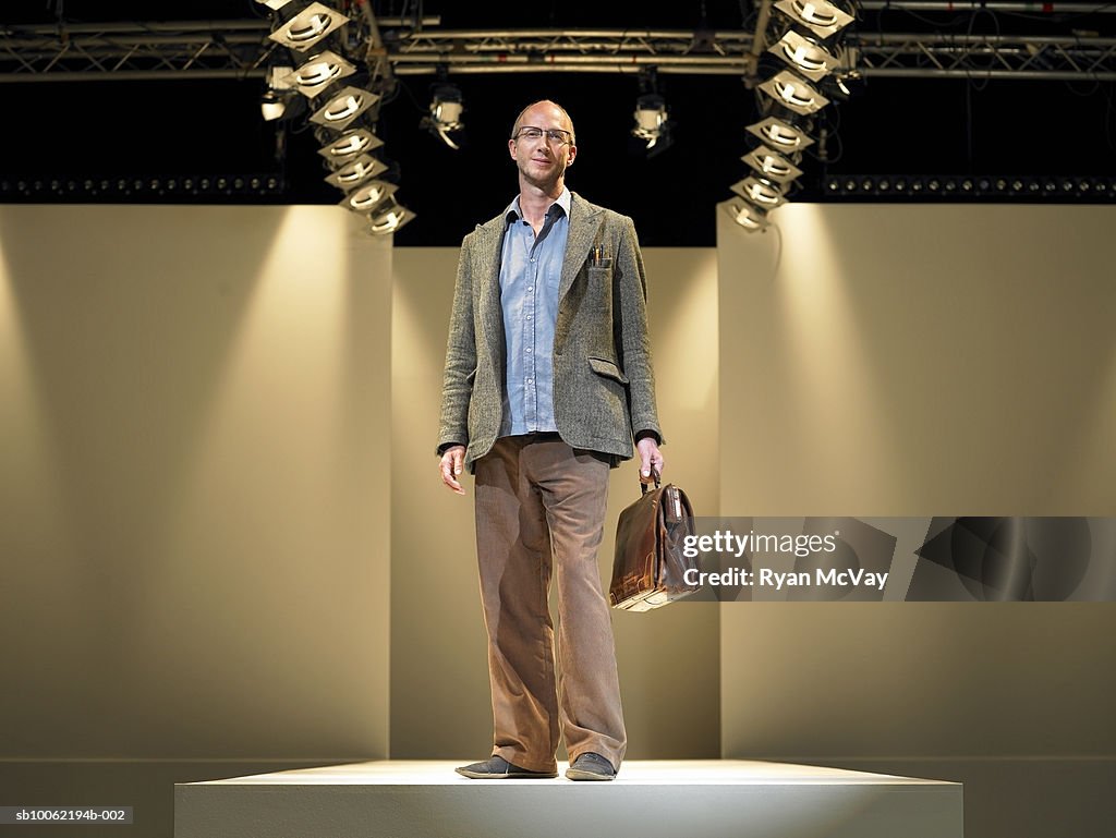 Business man on catwalk, portrait