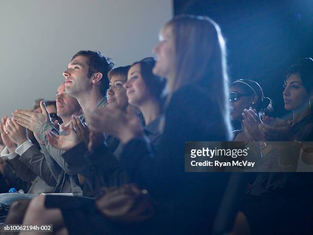 spectators applauding at fashion show - fashion show stock pictures, royalty-free photos & images