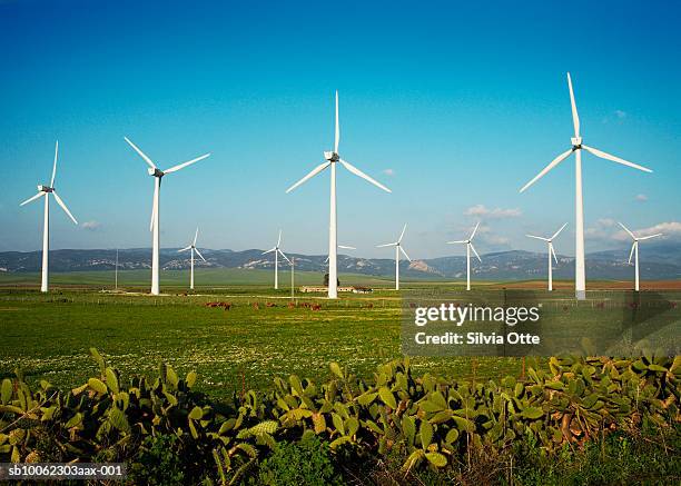 valley with wind turbines - energia eolica fotografías e imágenes de stock
